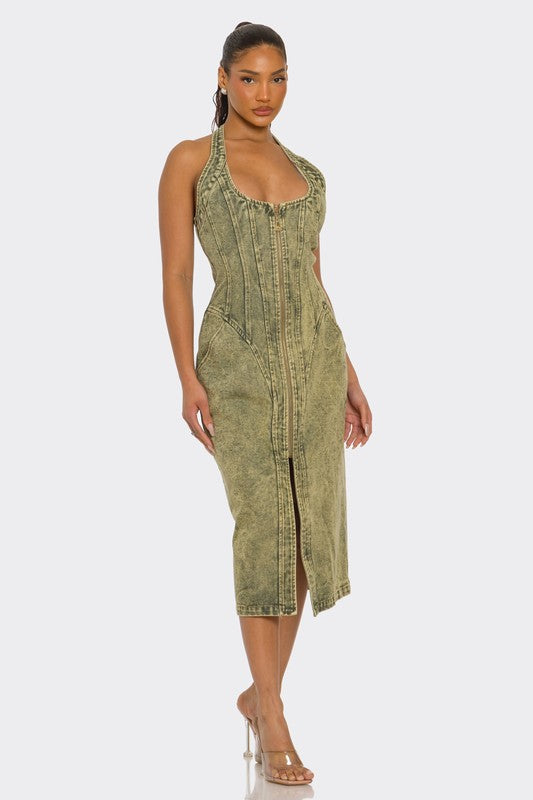 Woman wearing a green denim dress on a white background