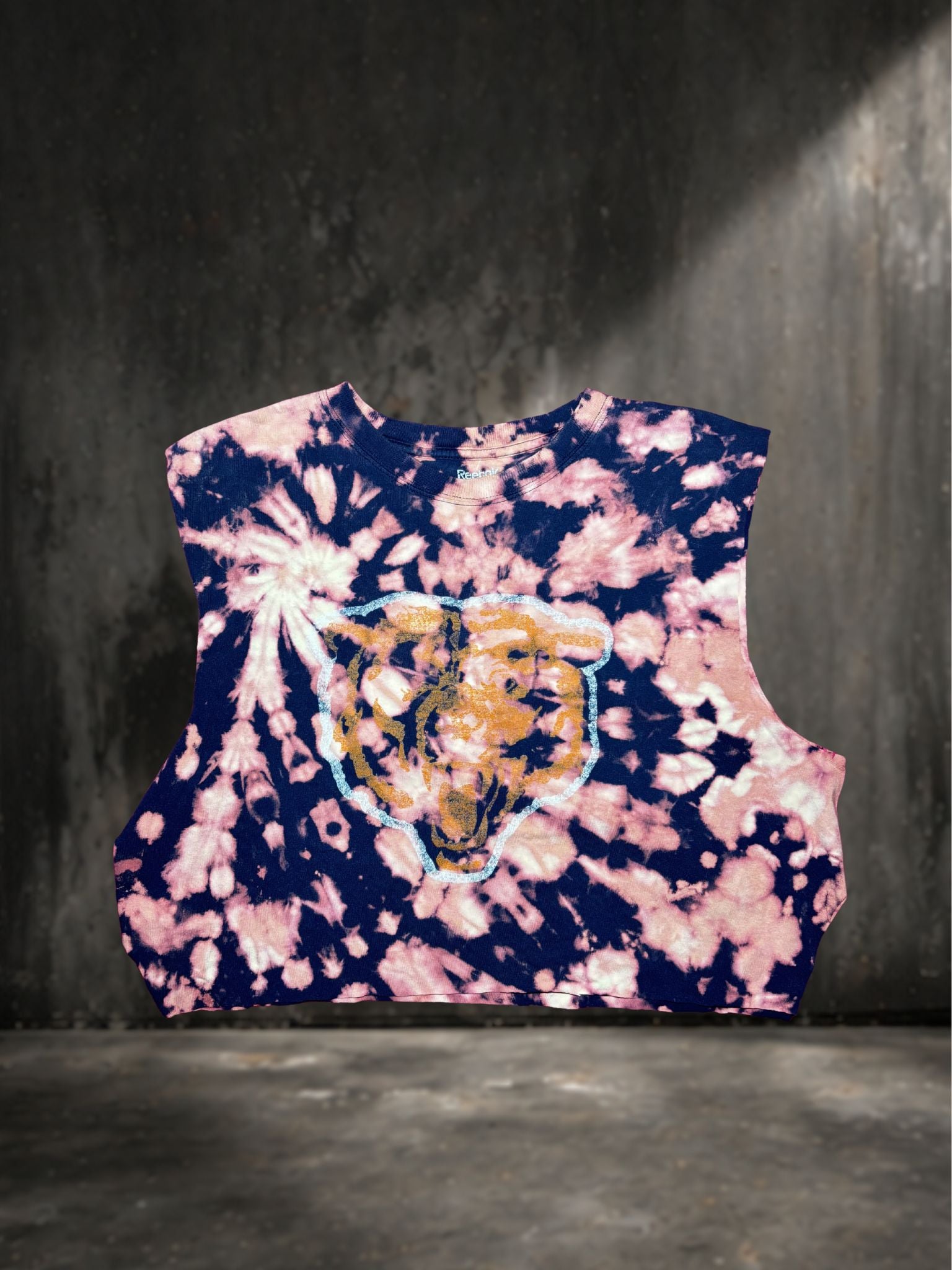 Tie-dye sleeveless top with a tiger design on a dark background