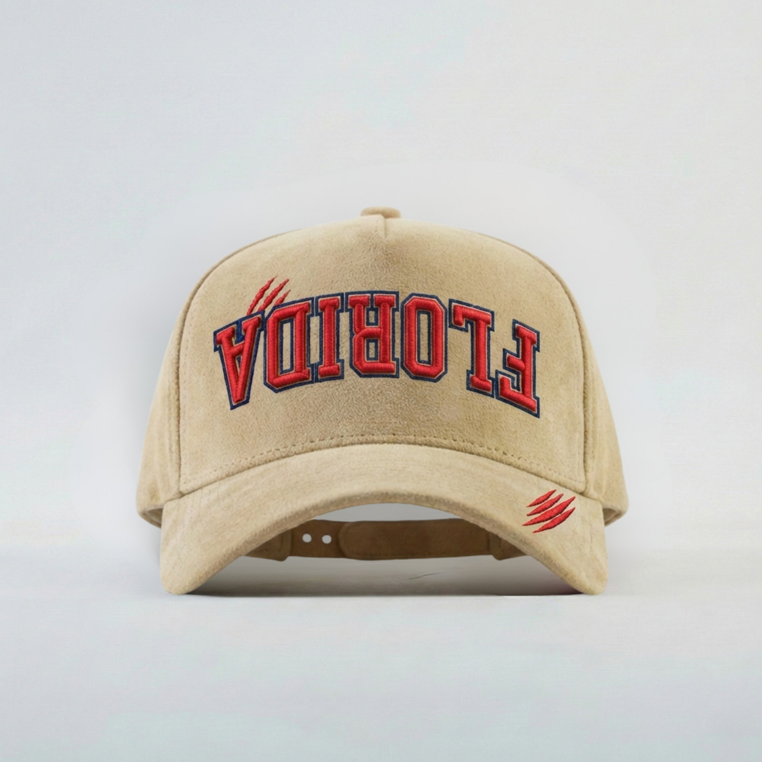 Beige cap with 'FLORIDA' embroidered upside down in red on a light gray background