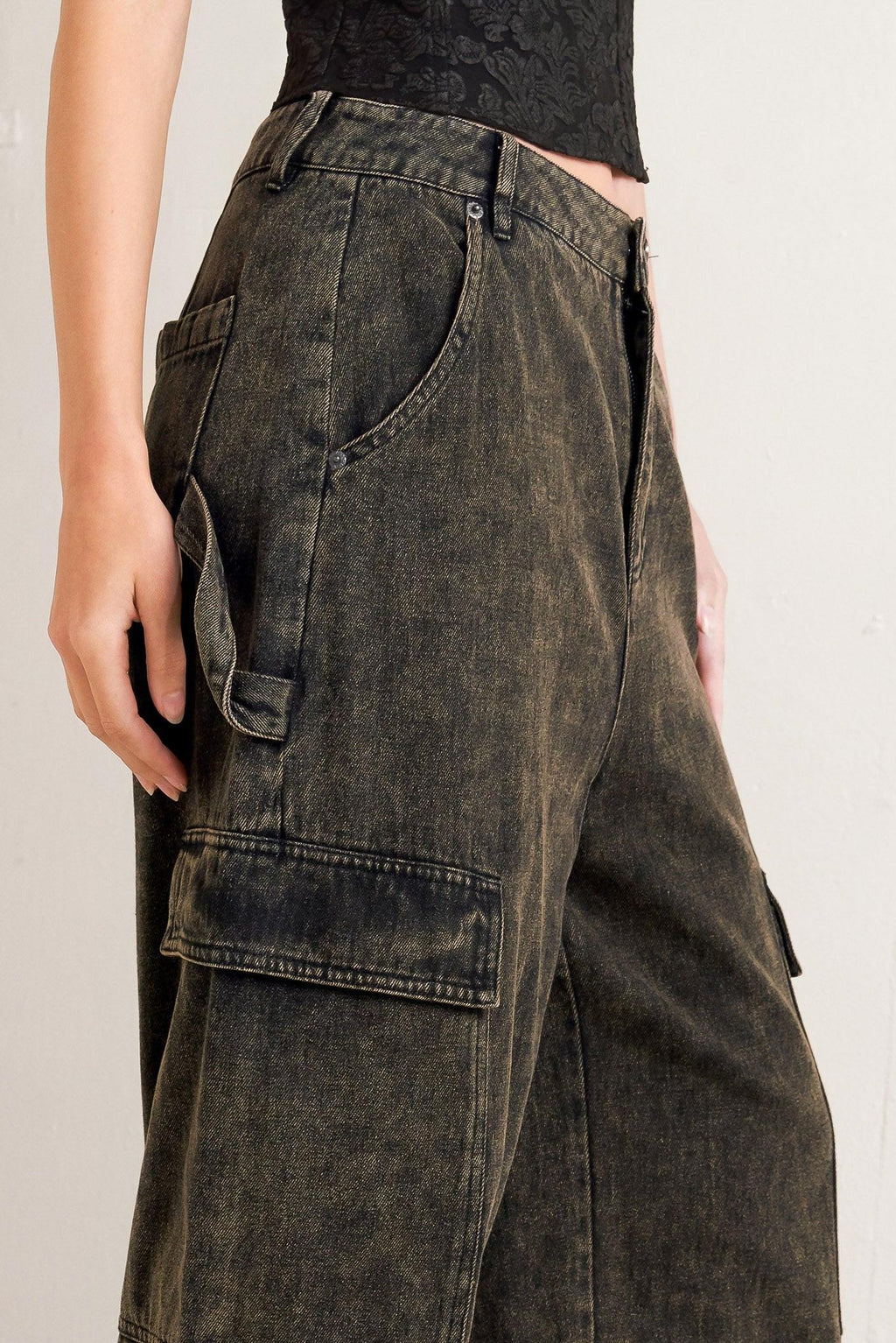 Dark denim cargo pants on a plain background
