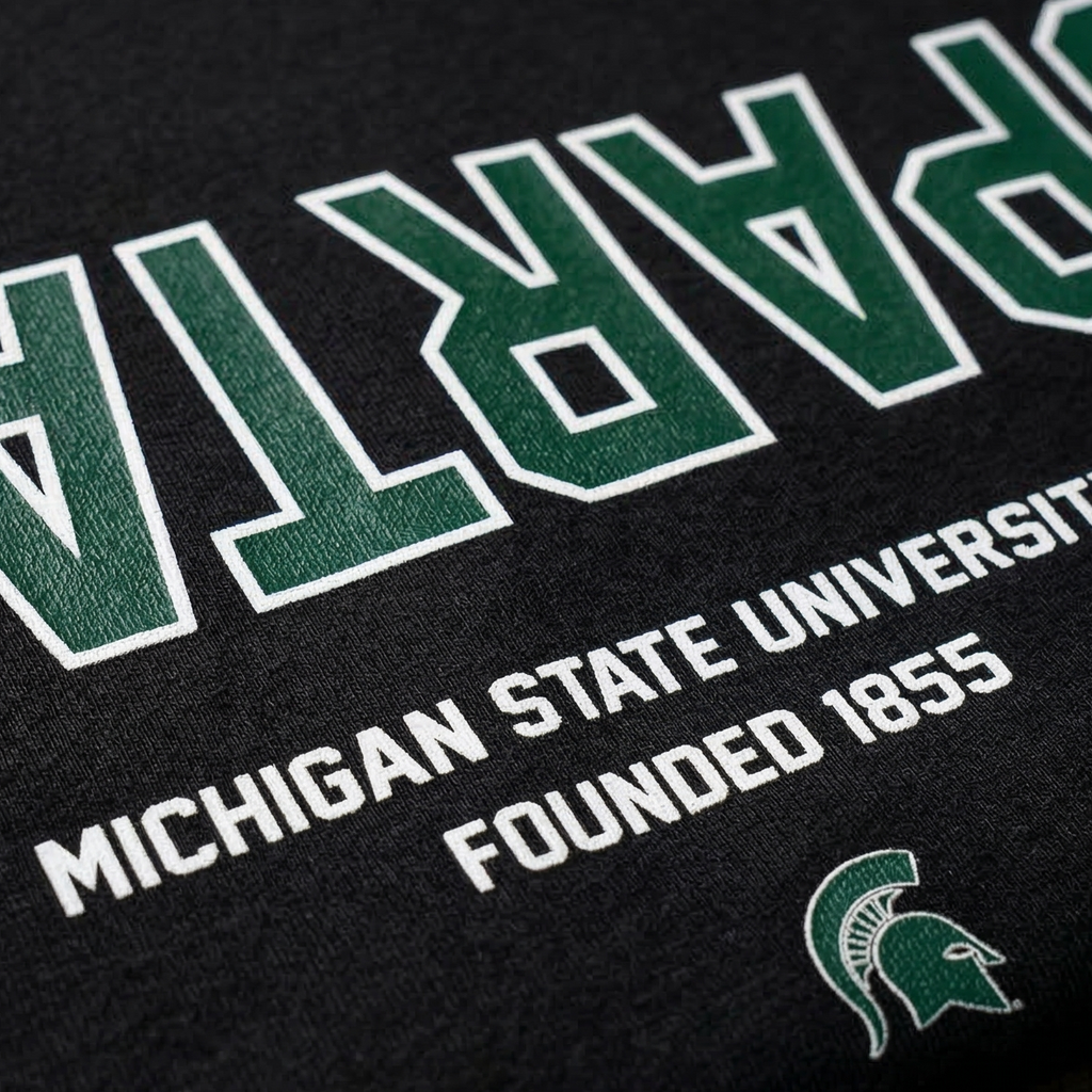 Black t-shirt with 'Spartans Michigan State University Founded 1855' text and logo.