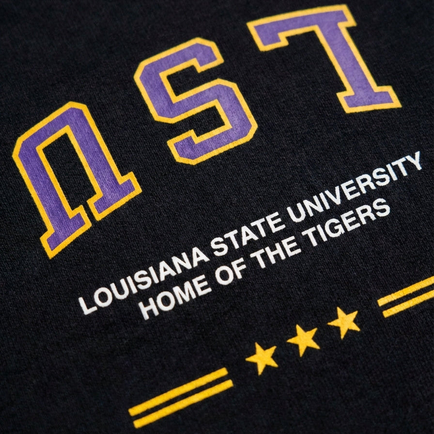 Black shirt with LSU logo and text 'Louisiana State University Home of the Tigers'