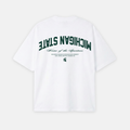 White t-shirt with Michigan State text and logo on a white background