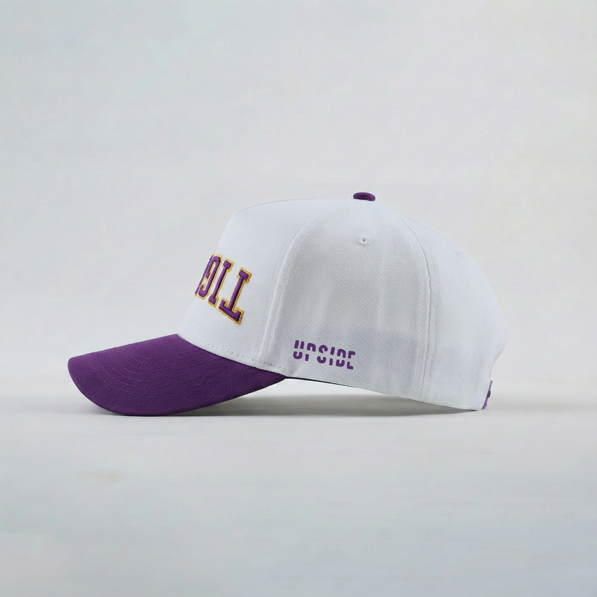 White and purple cap with text on a light gray background