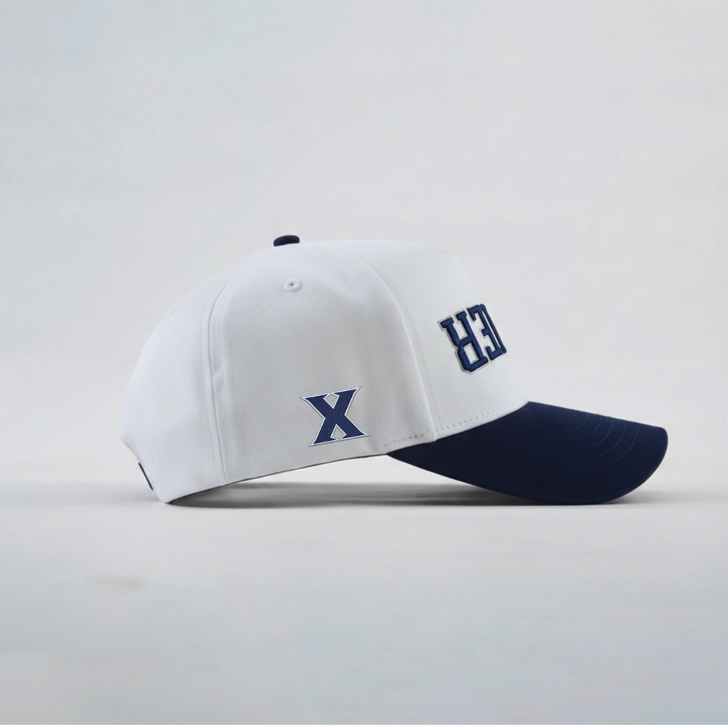 White and navy baseball cap with 'X' logo on a light gray background